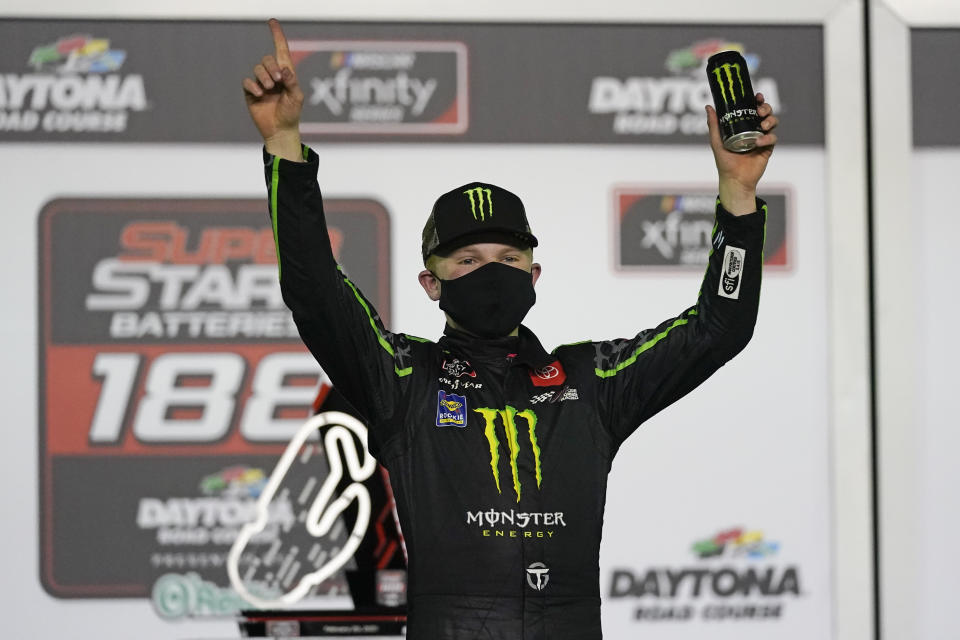 Ty Gibbs celebrates in Victory Lane after winning the NASCAR Xfinity Series road course auto race at Daytona International Speedway, Saturday, Feb. 20, 2021, in Daytona Beach, Fla. (AP Photo/John Raoux)