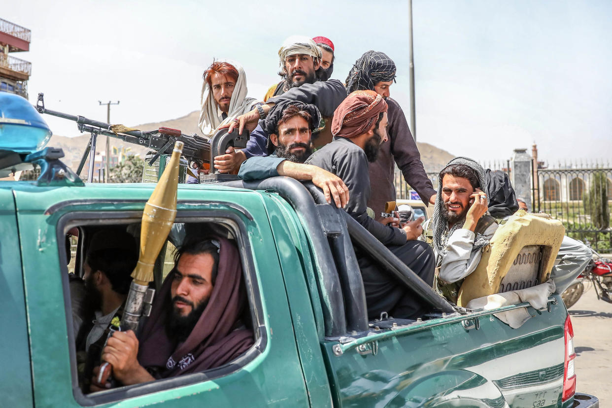 Taliban fighters in a pickup truck in Kabul on Monday. 