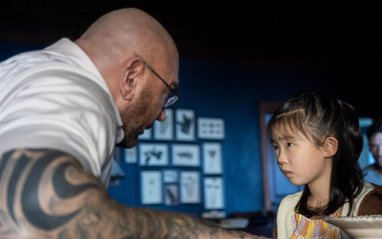 Dave Bautista and Kristen Cui in Knock at the Cabin - Mo Smith/Universal