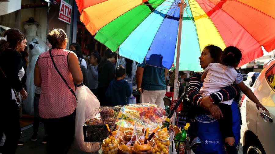 A street vendor sells food along Maple Avenue in Los Angeles' Fashion District in this undated photo. (Credit: Los Angeles Times)