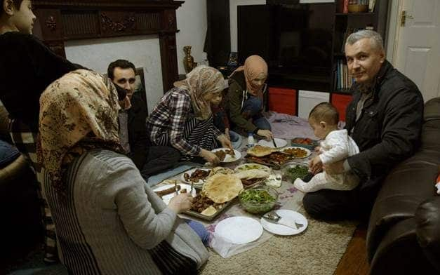 Ali, right, with his family of six in Cardiff - Channel 4