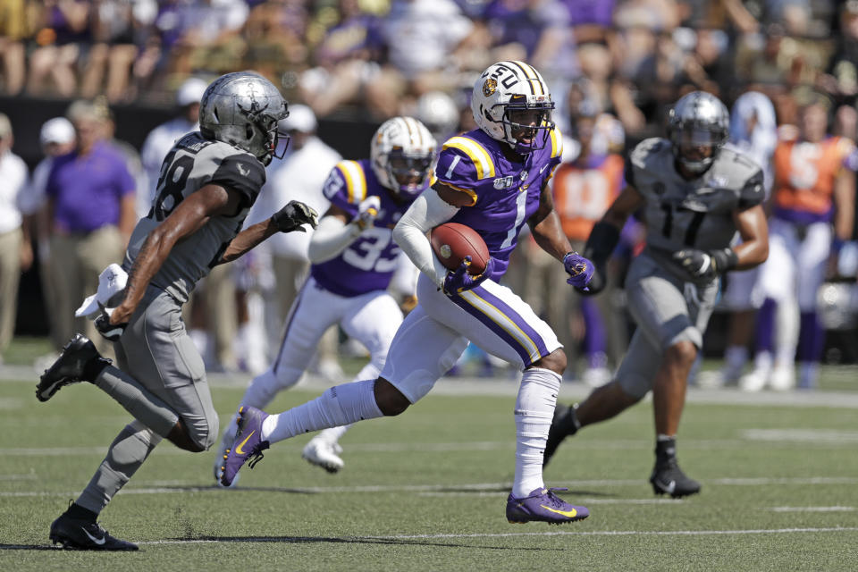 LSU wide receiver Ja'Marr Chase (1) scores a touchdown on a 51-yard pass play for a touchdown against Vanderbilt in the first half of an NCAA college football game Saturday, Sept. 21, 2019, in Nashville, Tenn. (AP Photo/Mark Humphrey)