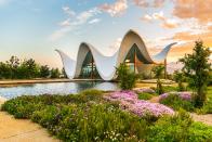 <p>Deep within South Africa’s wine country, an eye-catching chapel by Coetzee Steyn of <a href="http://www.steynstudio.com/" rel="nofollow noopener" target="_blank" data-ylk="slk:Steyn Studio;elm:context_link;itc:0;sec:content-canvas" class="link ">Steyn Studio</a> seamlessly blends Cape Dutch architecture with modern, more sustainable style. The curvaceous cast-concrete shell evokes the surrounding Waaihoek Mountains and pays tribute to the historic gables in the rural communities of the Western Cape. In order to keep the structure’s sculptural appearance sound, Steyn cleverly hid supportive elements in the plinth and inside the outer corners of the neighboring garden.</p>