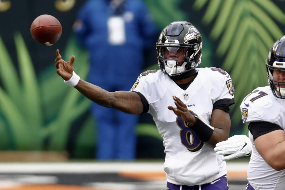 Baltimore Ravens quarterback Lamar Jackson (8) passes against the Cincinnati Bengals during the first half of an NFL football game, Sunday, Jan. 3, 2021, in Cincinnati. (AP Photo/Aaron Doster)