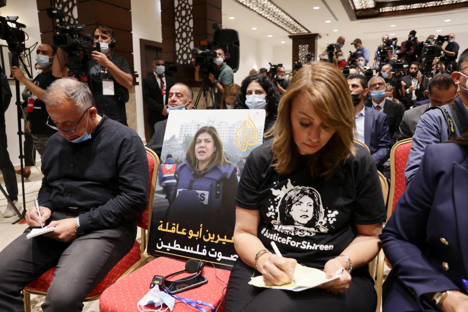 An image of slain Palestinian-American journalist Shireen Abu Akleh is placed on a chair at the leaders’ joint news conference (REUTERS)