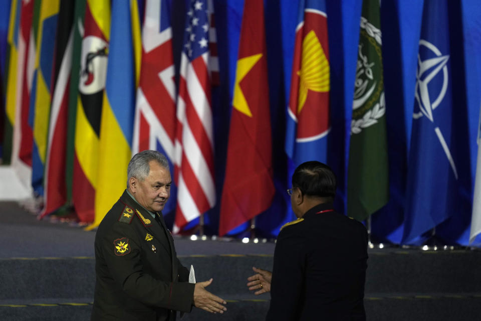 Russian Defense Minister Sergei Shoigu, left, leaves after speaking at the 10th Beijing Xiangshan Forum in Beijing, Monday, Oct. 30, 2023. Defense Minister Shoigu said Monday the United States is fueling geopolitical tensions to uphold its "hegemony" and warned of the risk of confrontation between major countries. (AP Photo/Ng Han Guan)