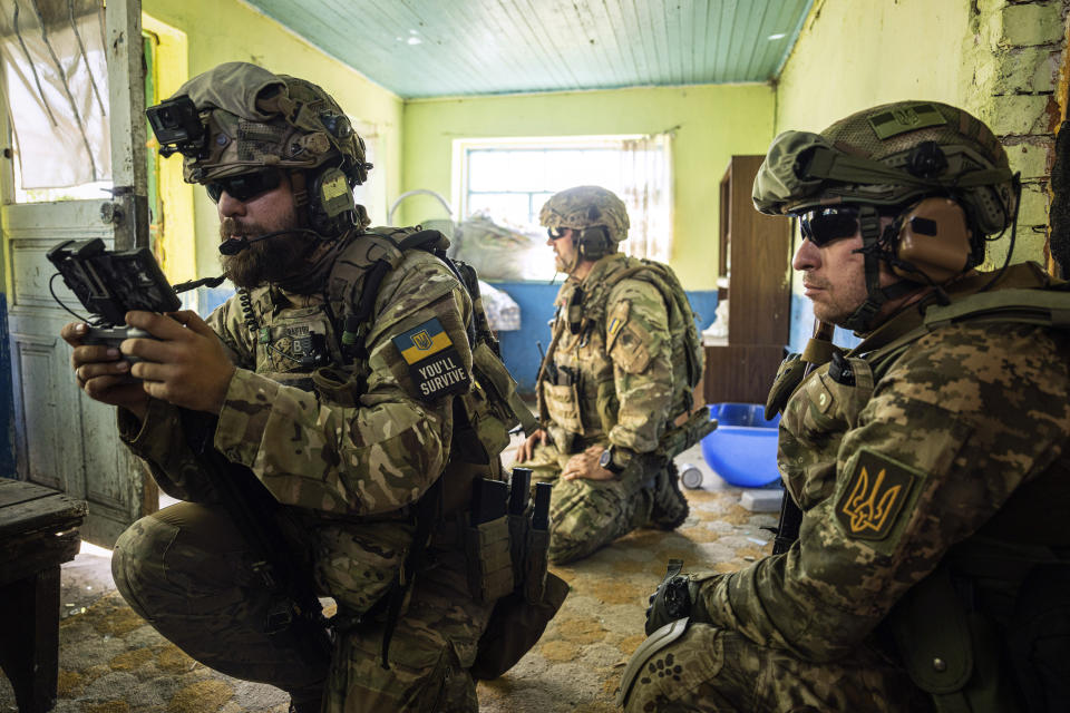 A Ukrainian serviceman of "Fireflies" reconnaissance team operates a drone at his position at the frontline in Mykolaiv region, Ukraine, on Monday, Aug. 8, 2022. (AP Photo/Evgeniy Maloletka)