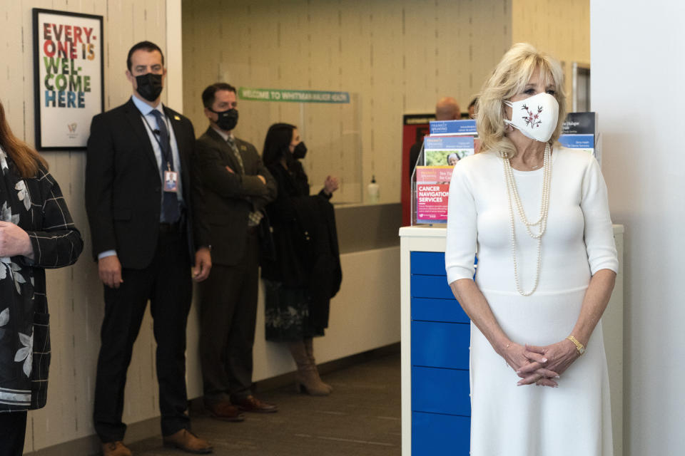 First lady Jill Biden, right, tours Whitman-Walker Health, Friday, Jan. 22, 2021, in Washington. (AP Photo/Jacquelyn Martin, Pool)