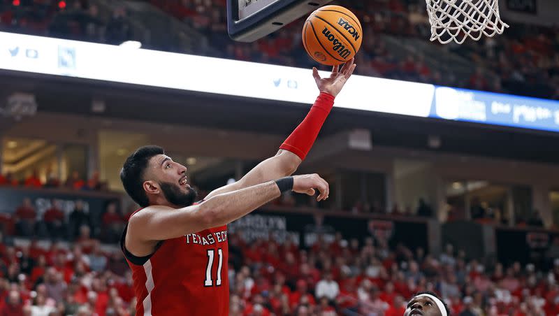 Texas Tech’s Fardaws Aimaq (11) lays up the ball during an NCAA college basketball game against Oklahoma State, Saturday, March 4, 2023, in Lubbock, Texas.