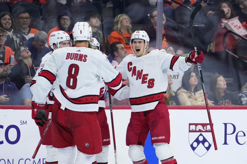 Carolina Hurricanes' Martin Necas, right, celebrates with teammates after scoring a goal during the third period of an NHL hockey game against the Philadelphia Flyers, Saturday, Oct. 29, 2022, in Philadelphia. (AP Photo/Matt Slocum)