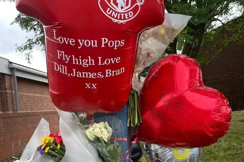 Flowers and balloons left for Barry Dillon following his death -Credit:Family handout