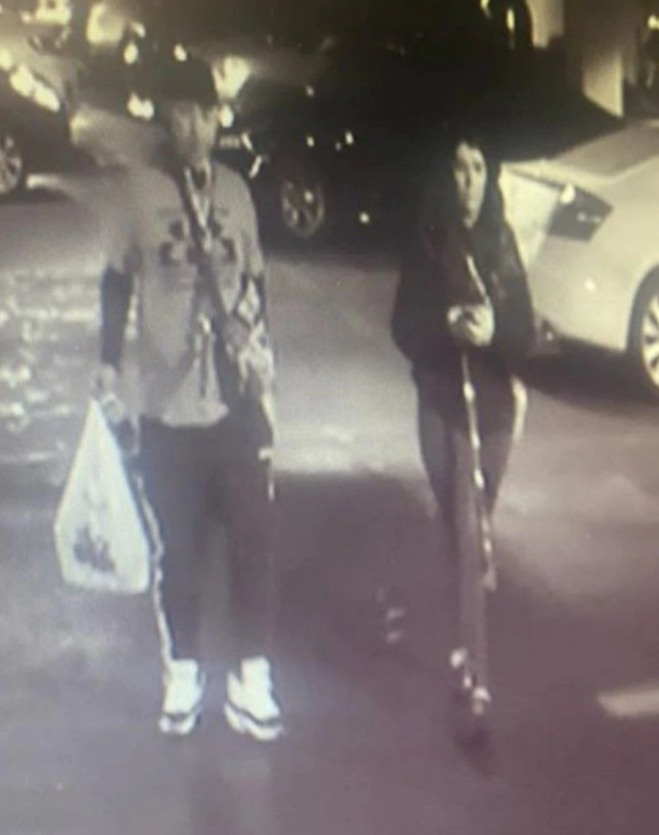 Anastasia Hamilton, 25, is seen in surveillance camera footage from the parking garage at her office in downtown Cleveland with an unknown man on 21 May. (Crimestoppers)