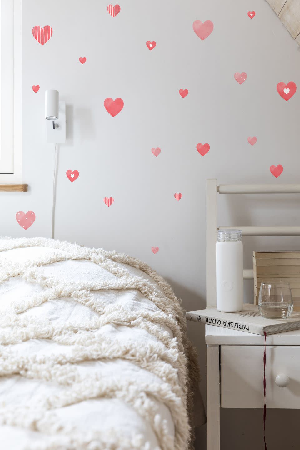 <p>A really easy way to transform bland walls is with red heart stickers, or similar. It's a great way to create an instant feature wall. These stickers can be positioned and repositioned many times, without leaving any residue behind on wall surfaces.</p><p>Pictured: Reusable Heart Wall Decals, <a href="https://www.stickers4walls.co.uk/Reusable_Valentines_Heart_Wall_Stickers/p1294546_20955380.aspx" rel="nofollow noopener" target="_blank" data-ylk="slk:Stickers4Walls;elm:context_link;itc:0;sec:content-canvas" class="link ">Stickers4Walls</a></p>