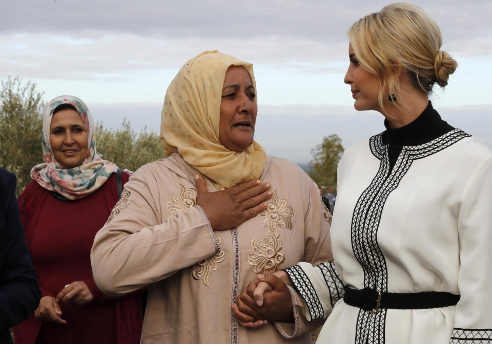 Farmer Aicha Bourkib talks to Ivanka Trump's hand, the daughter and senior adviser to President Donald Trump, in the province of Sidi Kacem, Morocco, Thursday, Nov. 7, 2019, as Ivanka Trump tours an olive grove collective where local women farmers are benefitting from changes allowing them to inherit land. (AP Photo/Jacquelyn Martin)