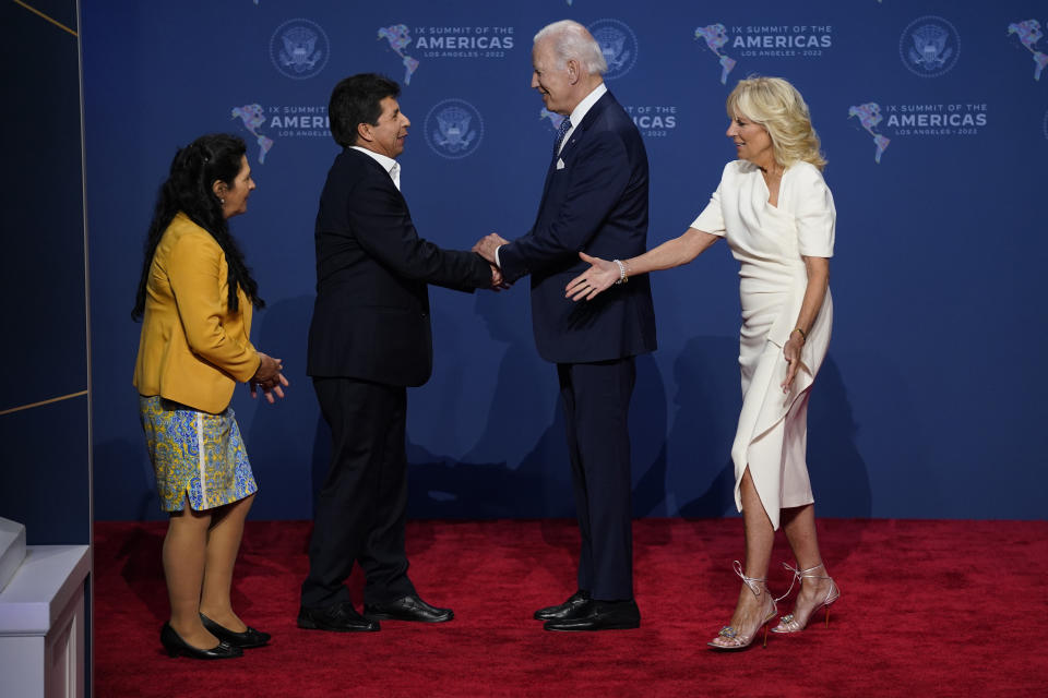 FILE - Peru's President Pedro Castillo and his wife Lilia Paredes, left, greet President Joe Biden and first lady Jill Biden during the Summit of the Americas, June 8, 2022, in Los Angeles. After a year in office, Castillo has seen his poll number fall as his administration has been beset by a myriad of troubles, ranging from accusations of corruption to having parliament attempt to remove him twice from office. (AP Photo/Evan Vucci, File)