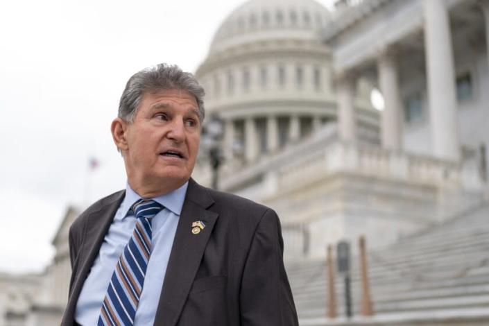 FILE - Sen. Joe Manchin, DW.Va., departs as the Senate goes into recess for Memorial Day, on Capitol Hill in Washington, on May 26, 2022. A Democratic economic package focused on climate and care Health care faces hurdles, but appears headed toward passage of the party line by Congress next month.  Senate Majority Leader Chuck Schumer, DN.Y., crafted a compromise package with Manchin, to everyone's surprise, transforming West Virginian from pariah to partner.  (AP Photo/J. Scott Applewhite, File)