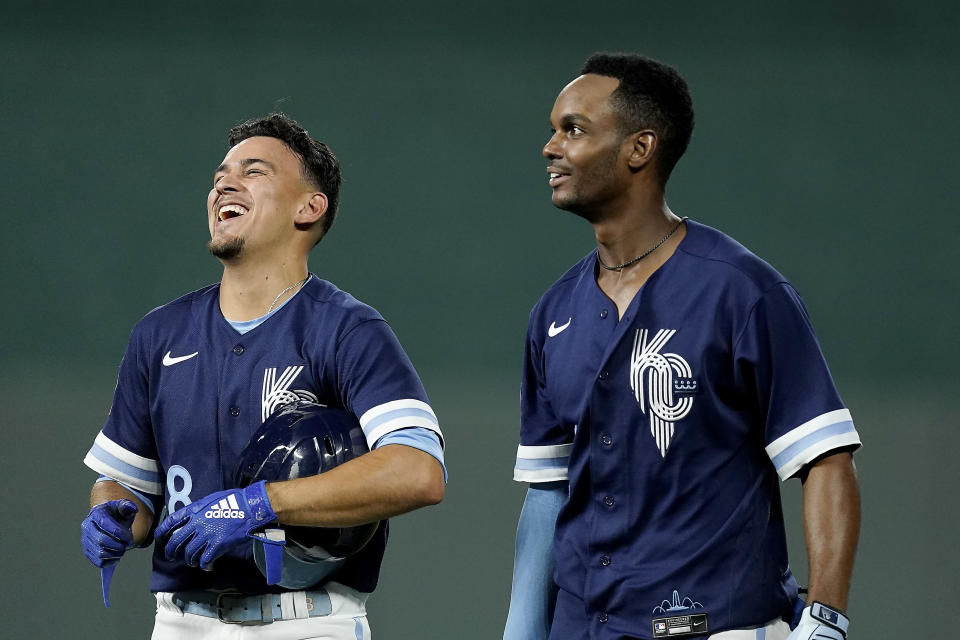 Kansas City Royals' Michael A. Taylor, right, celebrates with Nicky Lopez (8) after their baseball game against the Cleveland Guardians Friday, July 8, 2022, in Kansas City, Mo. The Royals won 4-3. (AP Photo/Charlie Riedel)