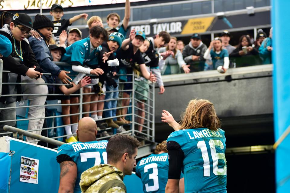 Jacksonville Jaguars quarterback Trevor Lawrence (16) throws his wristbands to fans after the game Sunday, Nov. 28, 2021 at TIAA Bank Field in Jacksonville. The Jaguars hosted the Falcons during a regular season NFL matchup. Atlanta defeated Jacksonville 21-14. 