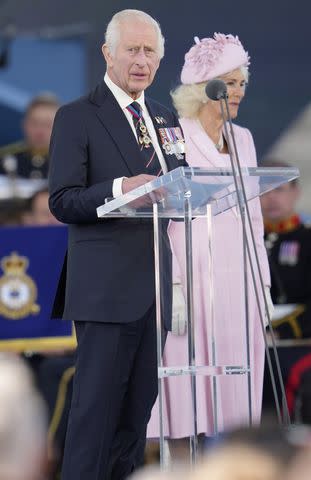 <p>Kin Cheung - Pool/Getty</p> King Charles and Queen Camilla at the U.K.’s national commemorative event marking the 80th anniversary of the D-Day Landings in Portsmouth, England, on June 5, 2024