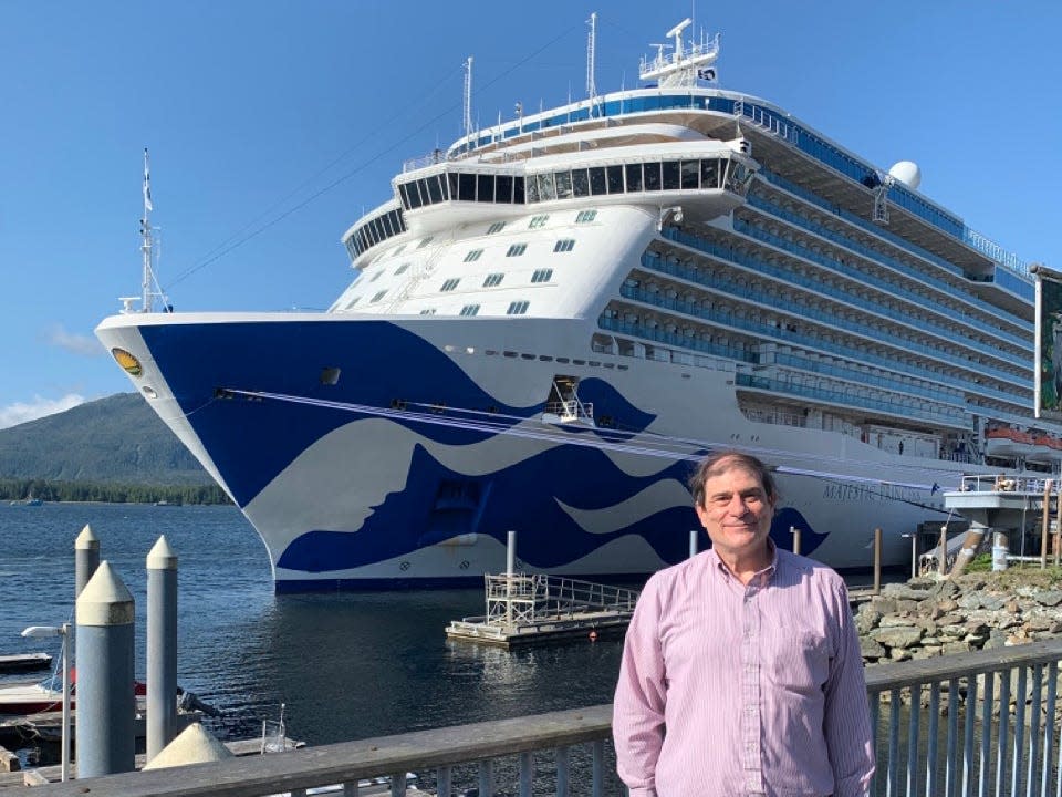 Author Bradley Carroll posing by cruise ship in Alaska