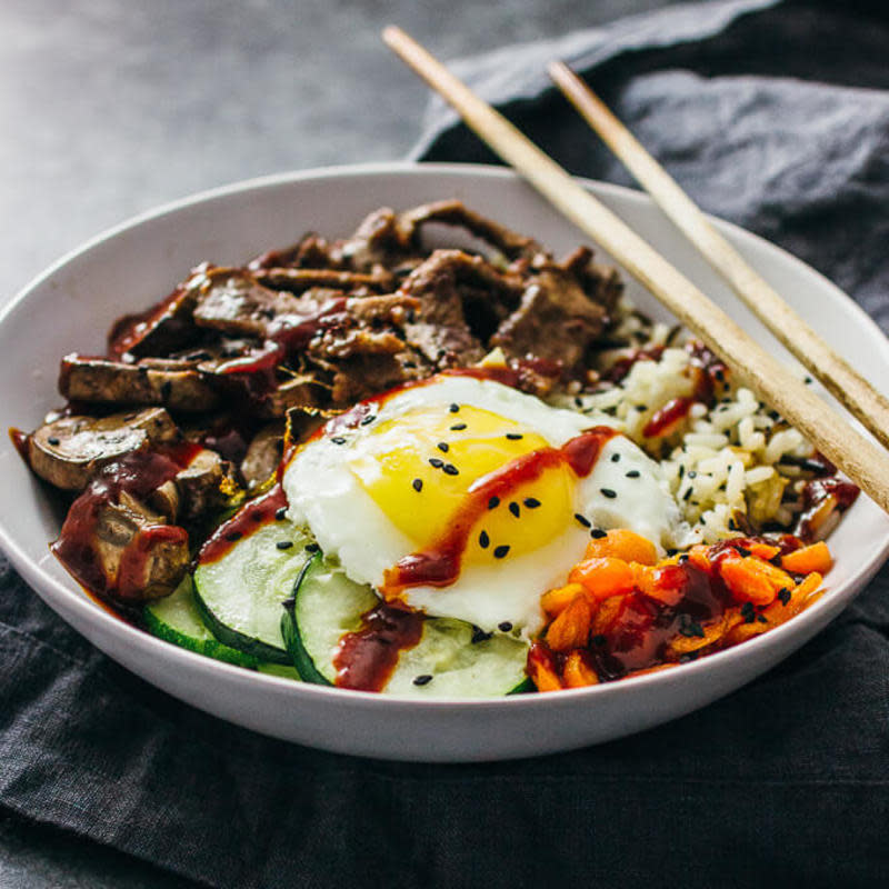 <p>Bibimbap is a Korean beef bowl with rice, marinated beef, an assortment of vegetables like mushrooms and zucchini, and sunny side up eggs. Everything’s tossed in a deliciously spicy-sweet bibimbap sauce.</p><p><strong>Get the recipe: <a href="https://www.savorytooth.com/bibimbap/" rel="nofollow noopener" target="_blank" data-ylk="slk:Bibimbap;elm:context_link;itc:0;sec:content-canvas" class="link rapid-noclick-resp">Bibimbap</a></strong></p>