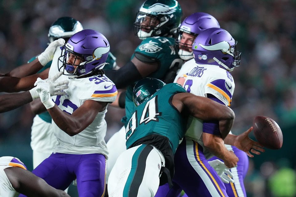 PHILADELPHIA, PENNSYLVANIA – SEPTEMBER 14: Kirk Cousins #8 of the Minnesota Vikings fumbles the ball as he is hit by Josh Sweat #94 of the Philadelphia Eagles during the third quarter at Lincoln Financial Field on September 14, 2023 in Philadelphia, Pennsylvania. (Photo by Mitchell Leff/Getty Images)