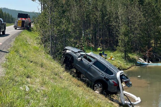 The passengers were able to get out of the acidic, 105 degree Fahrenheit water on their own and were taken to a hospital for treatment.