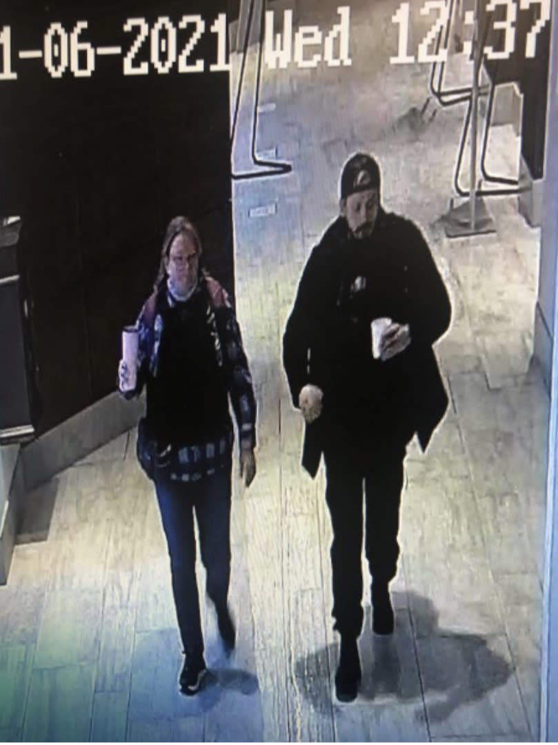 Image 1: CCTV still photograph showing Munchel and Eisenhart at their hotel, both wearing tactical vests (Exhibit 102)