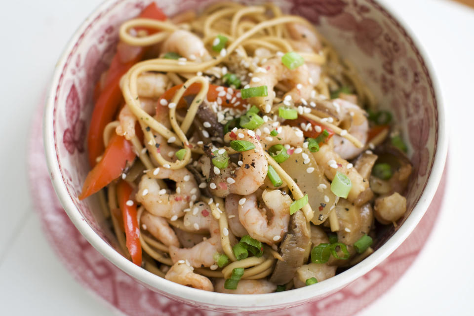 In this image taken on January 14, 2013, shrimp and shitake noodle stir-fry is shown served in a bowl in Concord, N.H. (AP Photo/Matthew Mead)