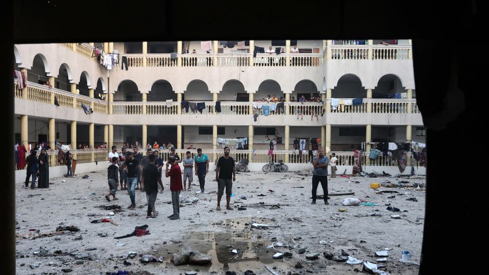 Displaced Palestinians gather in the yard of a school hit by an Israeli strike in Gaza City on August 10, 2024. - Omar al-Qattaa/AFP/Getty Images