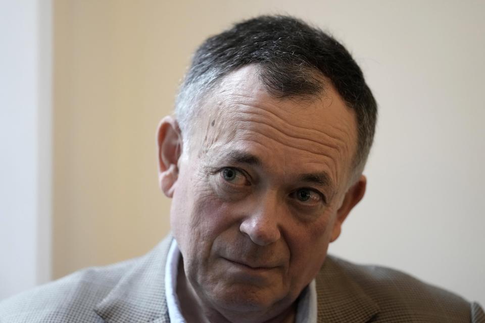 Businessman Ian Maxwell, brother of Ghislaine Maxwell listens, during an interview at his office in London, Monday, Nov. 15, 2021. The brother of a British socialite charged with helping Jeffrey Epstein exploit underage girls says her prosecution is “the most over-hyped trial of the century,” designed to break a woman targeted by authorities desperate to blame someone for the late financier’s crimes. Ghislaine Maxwell continues to have the backing of her family, and a family member will be in court at all times to show their support, Ian Maxwell said in an interview ahead of the trial, which is set to begin Nov. 29 in U.S. District Court in Manhattan. (AP Photo/Kirsty Wigglesworth)