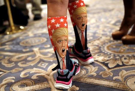 11-Year-old Millie March wears socks with the image of Republican presidential nominee Donald Trump on them at a Trump campaign event at the Trump International Hotel in Washington, D.C., U.S., September 16, 2016. REUTERS/Mike Segar