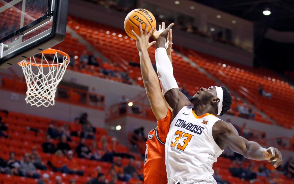 Oklahoma State's Moussa Cisse (33) goes up for a rebound in the first half during the men's college basketball game between the Oklahoma State University Cowboys (OSU) andSam Houston State University BearKats at Gallagher-Iba Arena in Stillwater, Okla., Tuesday, Dec.6, 2022. 