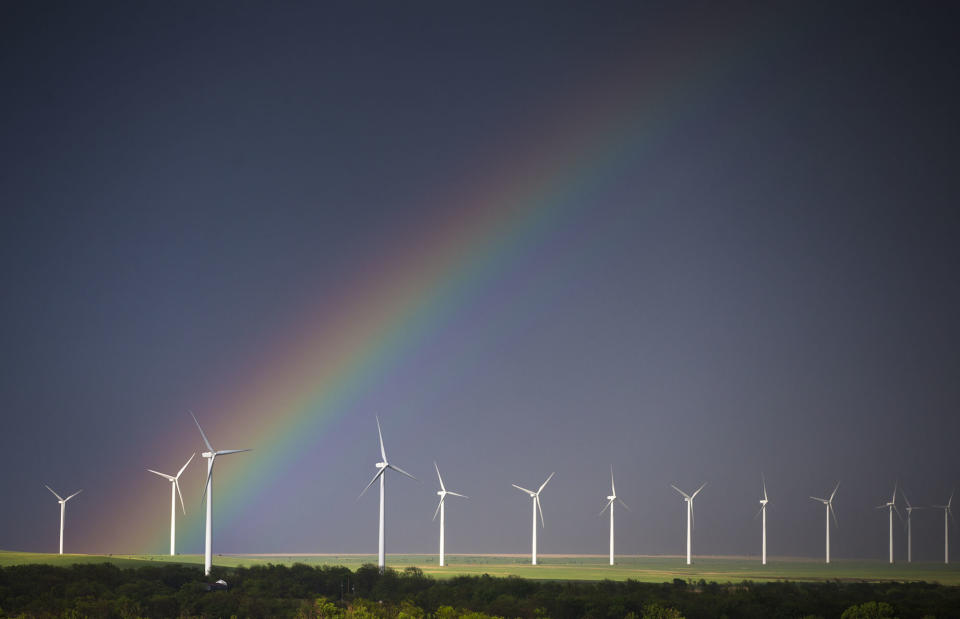 A rainbow forms over a wind-energy farm near Latham, Kan., on Thursday, May 8, 2014. The rainbow came from the tail end of a line of thunderstorms that reached from Minnesota to the Kansas and Oklahoma border. (AP Photo/The Wichita Eagle, Travis Heying) LOCAL TV OUT; MAGS OUT; LOCAL RADIO OUT; LOCAL INTERNET OUT