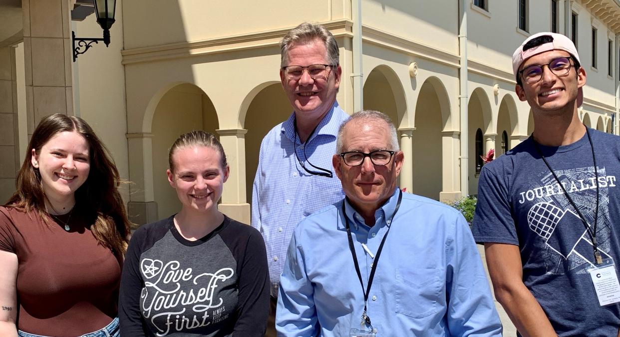 The Community News Collaborative team, from left, consists of reporters Sarah Owens, Catherine Hicks, Jim DeLa and Alejandro Romero. Editor Eric Garwood, center, oversees the team.