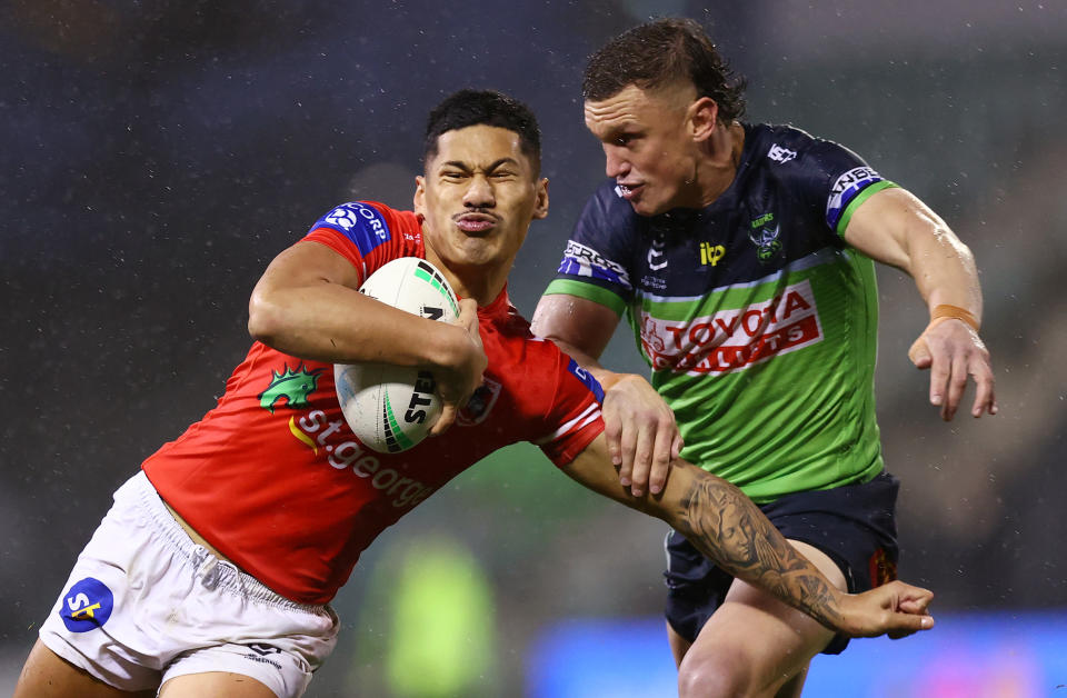 Pictured here, Dragons star Talatau Amone is tackled by Jack Wighton during the round 16 match against the Raiders. 