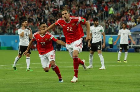 Soccer Football - World Cup - Group A - Russia vs Egypt - Saint Petersburg Stadium, Saint Petersburg, Russia - June 19, 2018 Russia's Artem Dzyuba celebrates scoring their third goal with Aleksandr Samedov REUTERS/Pilar Olivares