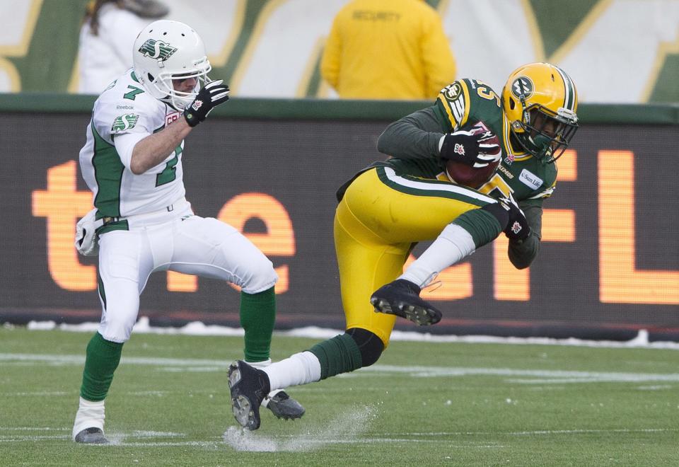 Chris Rwabukamba (15) had lots of highlights for Edmonton last year, including this interception in the West semifinal. Now, he's the biggest new addition to the B.C. Lions. (Jason Franson/The Canadian Press.)