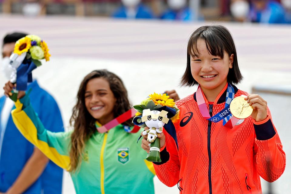 13-year-old skateboarders Momiji Nishiya (JPN) and Rayssa Leal (BRA) celebrate with their medals in the women's street skateboard event during the Tokyo 2020 Olympic Summer Games at Ariake Urban Sports Park on July 26, 2021.