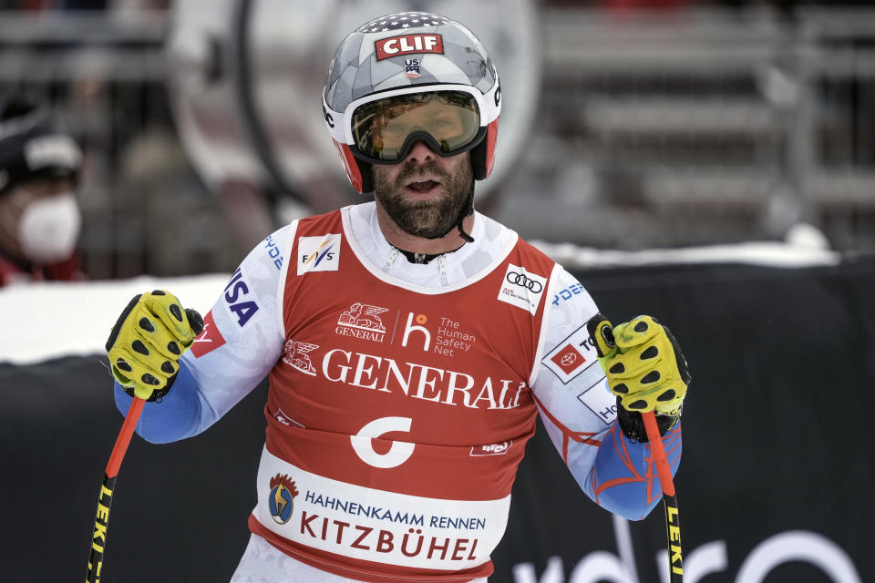 FILE - United States' Travis Ganong gets to the finish area after completing an alpine ski, men's World Cup downhill, in Kitzbuehel, Austria, Friday, Jan. 21, 2022. Ganong announced Thursday his journey on ski racing’s World Cup carousel ends after the season. Ganong announced Thursday, March 2, 2023, his journey on ski racing’s World Cup carousel ends after the season. (AP Photo/Giovanni Auletta, File)