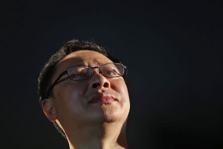 Founder of the Occupy Central civil disobedience movement, academic Benny Tai, looks up during campaign to kick off the movement in front of the financial Central district in Hong Kong August 31, 2014. REUTERS/Bobby Yip