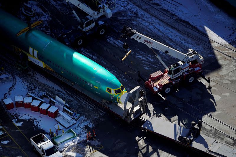 FILE PHOTO: An airplane fuselage for Boeing's 737 Max is unloaded from a rail car at their top supplier, Spirit AeroSystems Holdings Inc, in Wichita