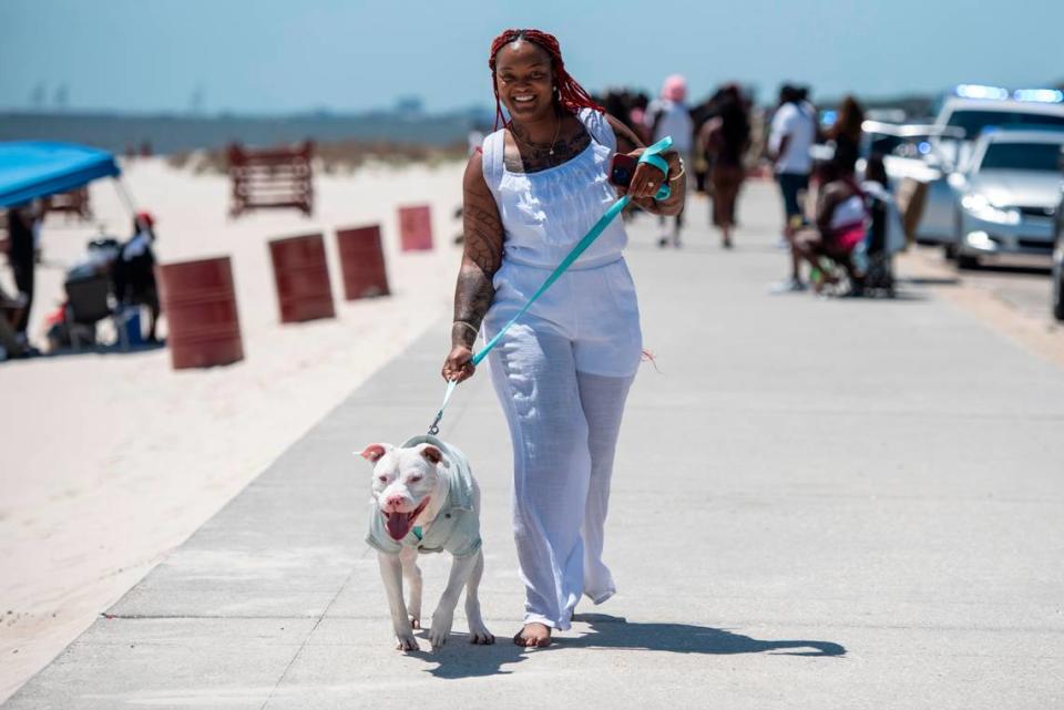 Jessica Cameron, of Tuscaloosa, Ala., walks her dog Diamond during Black Spring Break in Biloxi on Saturday, April 13, 2024