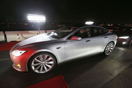 New all-wheel-drive versions of the Tesla Model S car are lined up for test drives in Hawthorne, California October 9, 2014. REUTERS/Lucy Nicholson