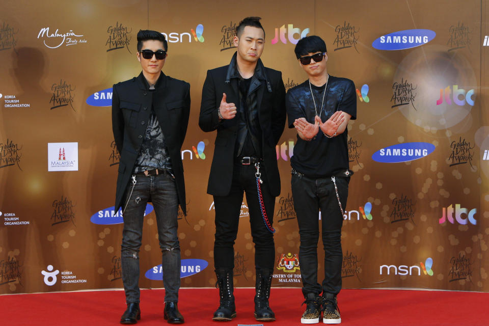 FILE - In this Jan. 16, 2013, file photo, South Korean alternative hip-hop group Epik High poses for photographers as they arrive on the red carpet ahead of the 27th Golden Disk Awards at Sepang International Circuit in Sepang, Malaysia. Popular South Korean hip-hop trio Epik High was working on a song called “End of the World” before the pandemic hit in 2020. Now, the band's frontman Tablo says, “I wish that this song is not relevant.” (AP Photo/Lai Seng Sin, File)