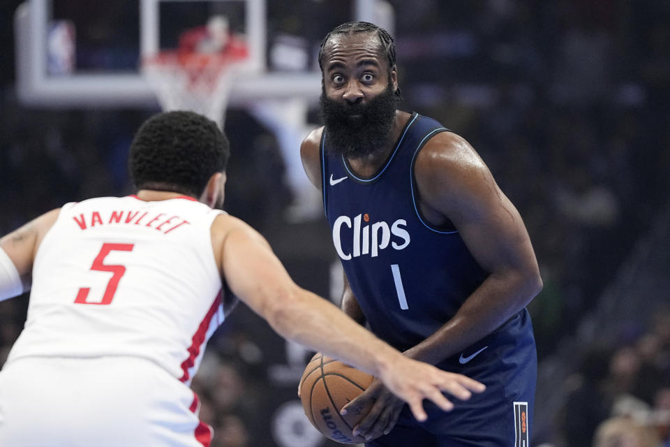 Los Angeles Clippers guard James Harden, right, looks to pass while under pressure from Houston Rockets guard Fred VanVleet during the first half of an NBA basketball In-Season Tournament game Friday, Nov. 17, 2023, in Los Angeles. (AP Photo/Mark J. Terrill)