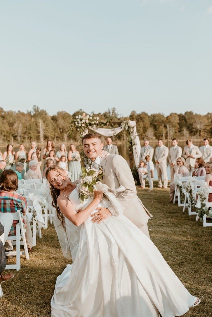 Lexi and Brady Butler on their wedding day at Lilly Creek Farm in Belden, Mississippi on September 30, 2023. Sandra Lynn Henson, 57, pleaded guilty on Wednesday, to crashing the couple's wedding reception and stealing from at least one guest - a crime court records show the woman is no stranger to.