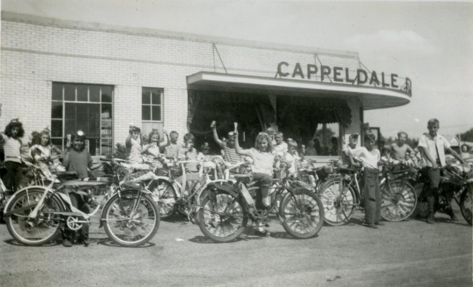 Children pose in front of the Cappeldale Farms Dairy store on Crater Avenue in Dover.