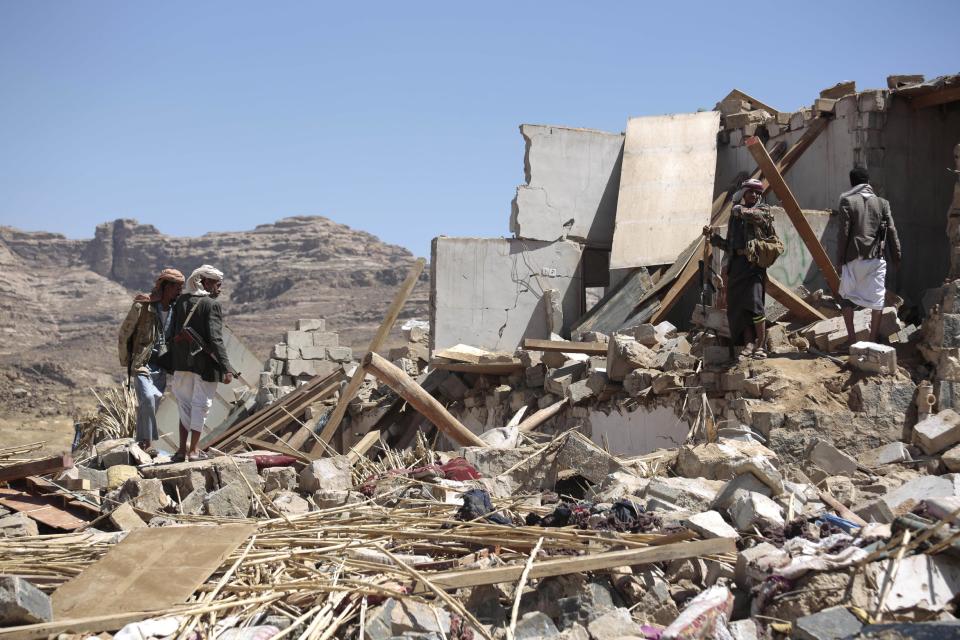 People inspect the rubble of a house destroyed by a Saudi-led airstrike in the outskirts of Sanaa, Yemen, Thursday, Feb. 16, 2017. At least one Saudi-led airstrike near Yemen's rebel-held capital killed at least five people on Wednesday, the country's Houthi rebels and medical officials said. (AP Photo/Hani Mohammed)