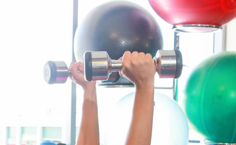 A personal trainer lifts weights at a Fitness First club. Picture: Michael O'Brien/The West Australian.